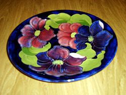 Moorcroft shallow dish, featuring the Clematis design