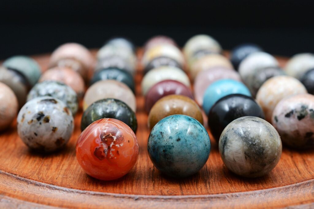 Coloured balls on a solitaire board