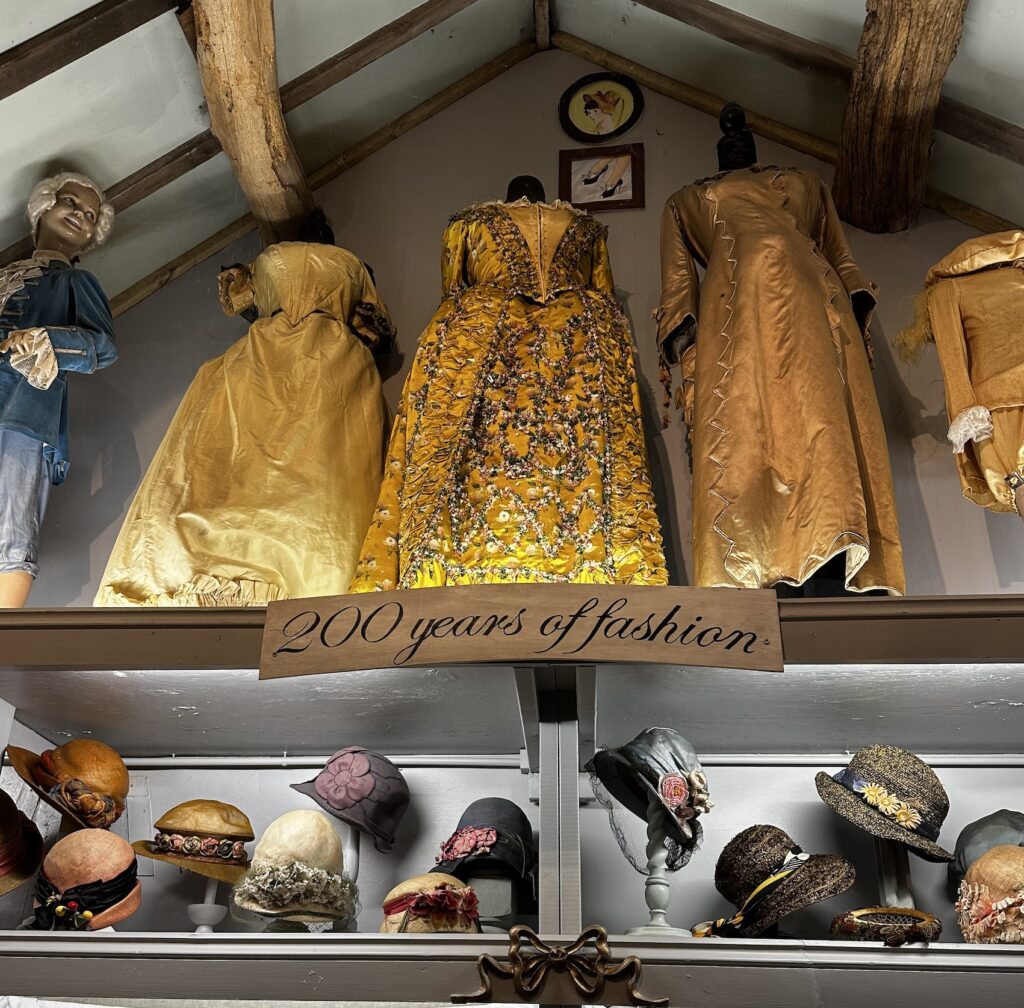 Hope House Costume Museum - satin evening dresses and a collection of period hats