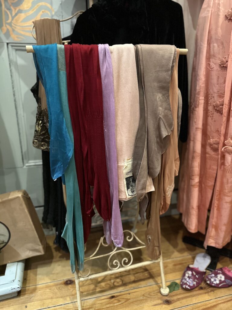 Hope House Costume Museum - rack of stockings in a variety of colours
